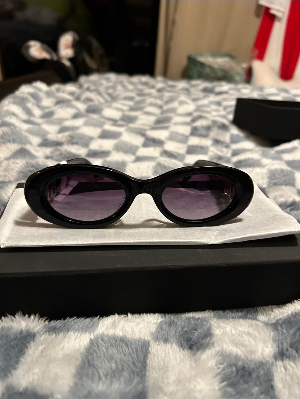 Karen Caroline Lemke, thick plastic frame glasses, purple lens, gold accent